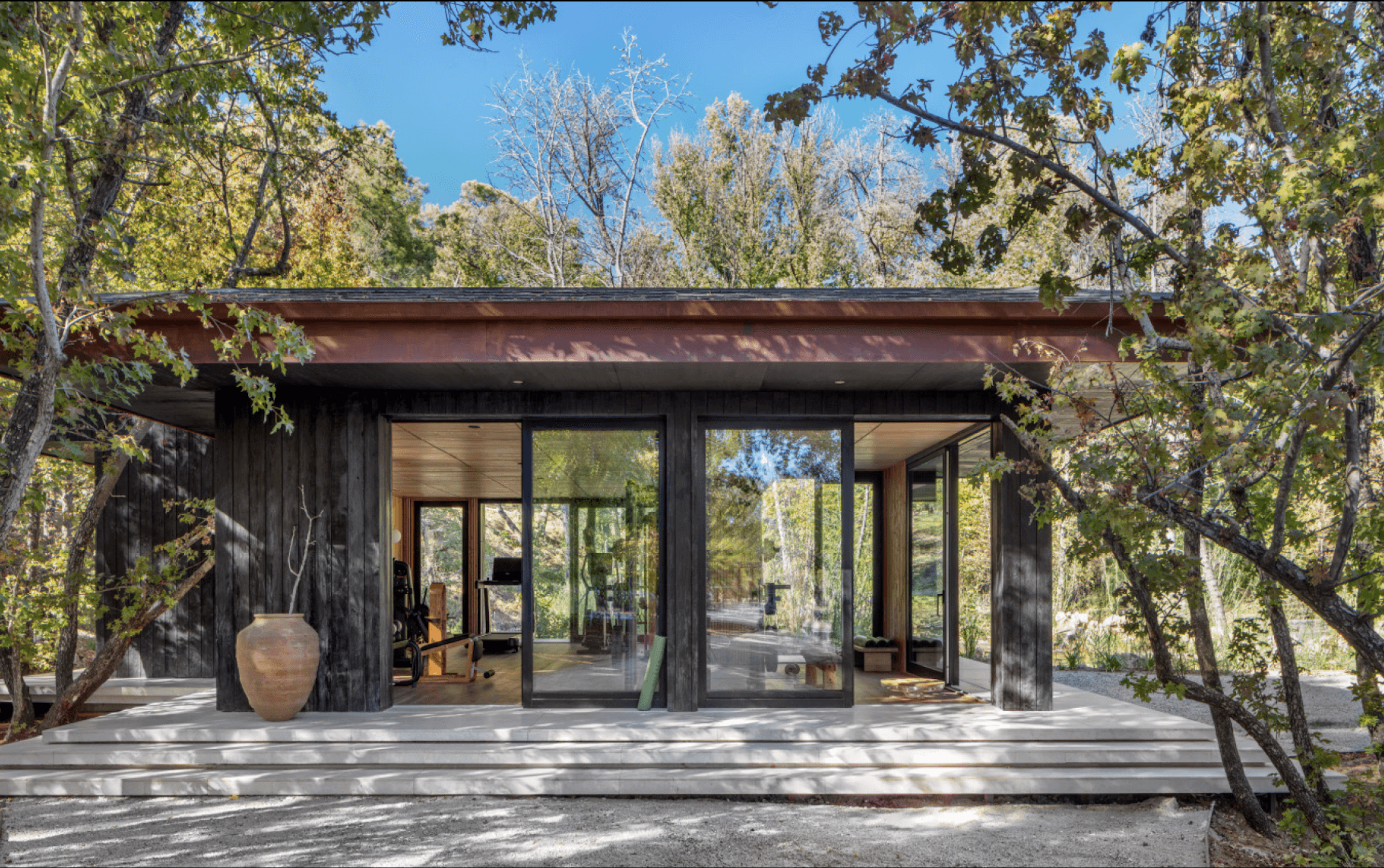 In a clearing between forest and lake, movement finds its own kind of peace. Ahama gym is enclosed in glass, open to the trees.